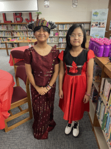 Two students in their traditional cultural outfits.