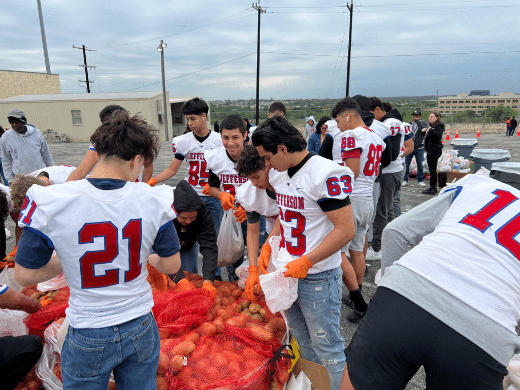 Students and volunteers from Jefferson High School distributed food bundles