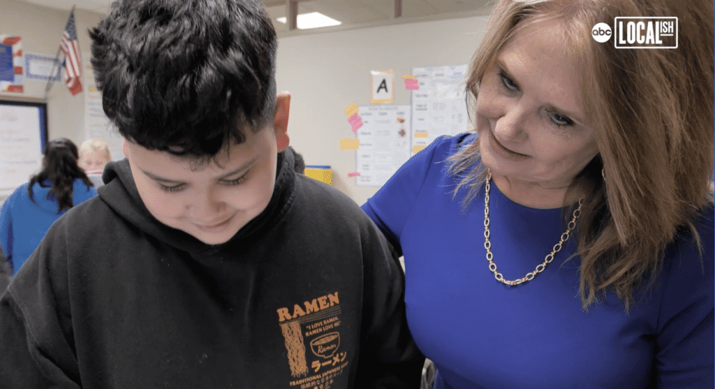 Superintendent Carol Nelson with a student.