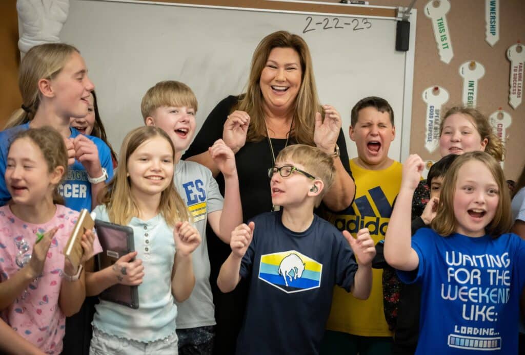 Classroom poses for group photo.