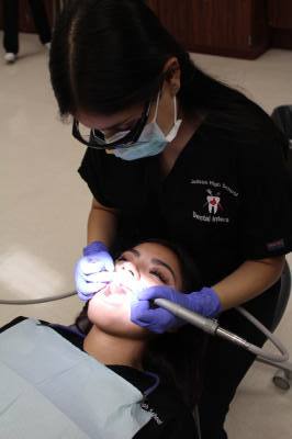 Student practicing dental work.