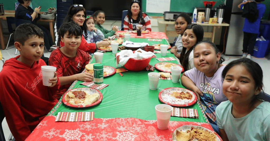 Students share a meal together.