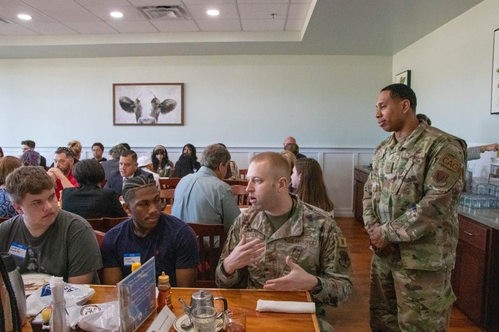 Students chat with professionals in the military