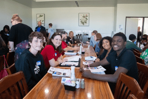 Students sit with professionals to chat about careers