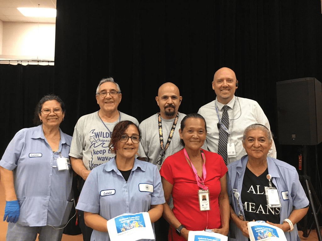 SCUC custodians posing after thanks