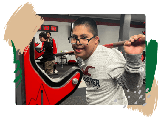 A member of the Judson ISD Special Olympics team lifts weights.